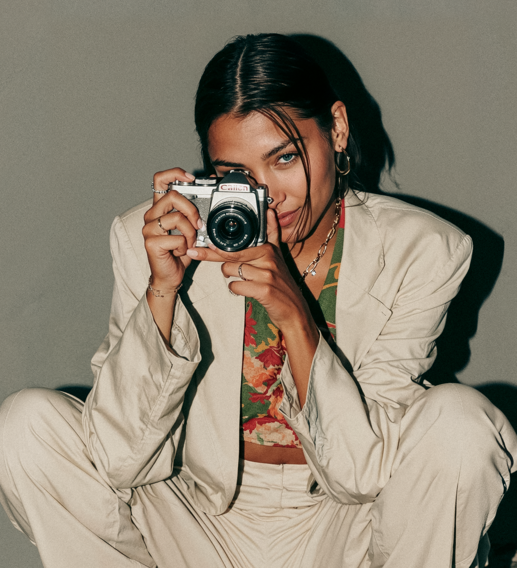 Woman taking a photo with a digital camera